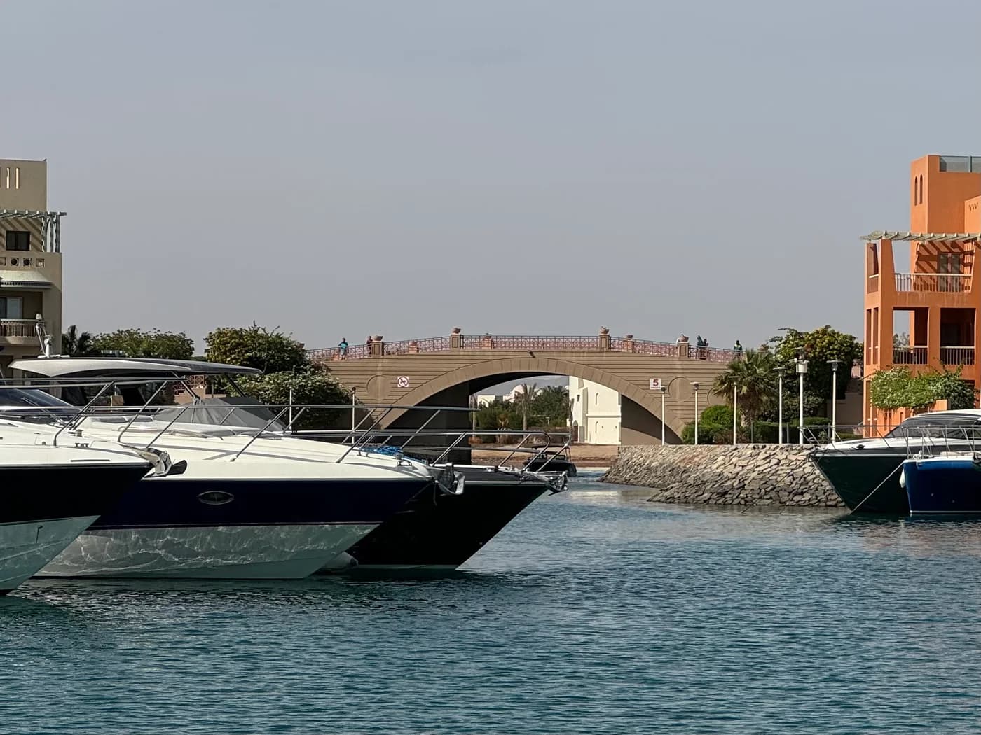 Boats and waterfront buildings beside the bridge at New Marina in El Gouna.