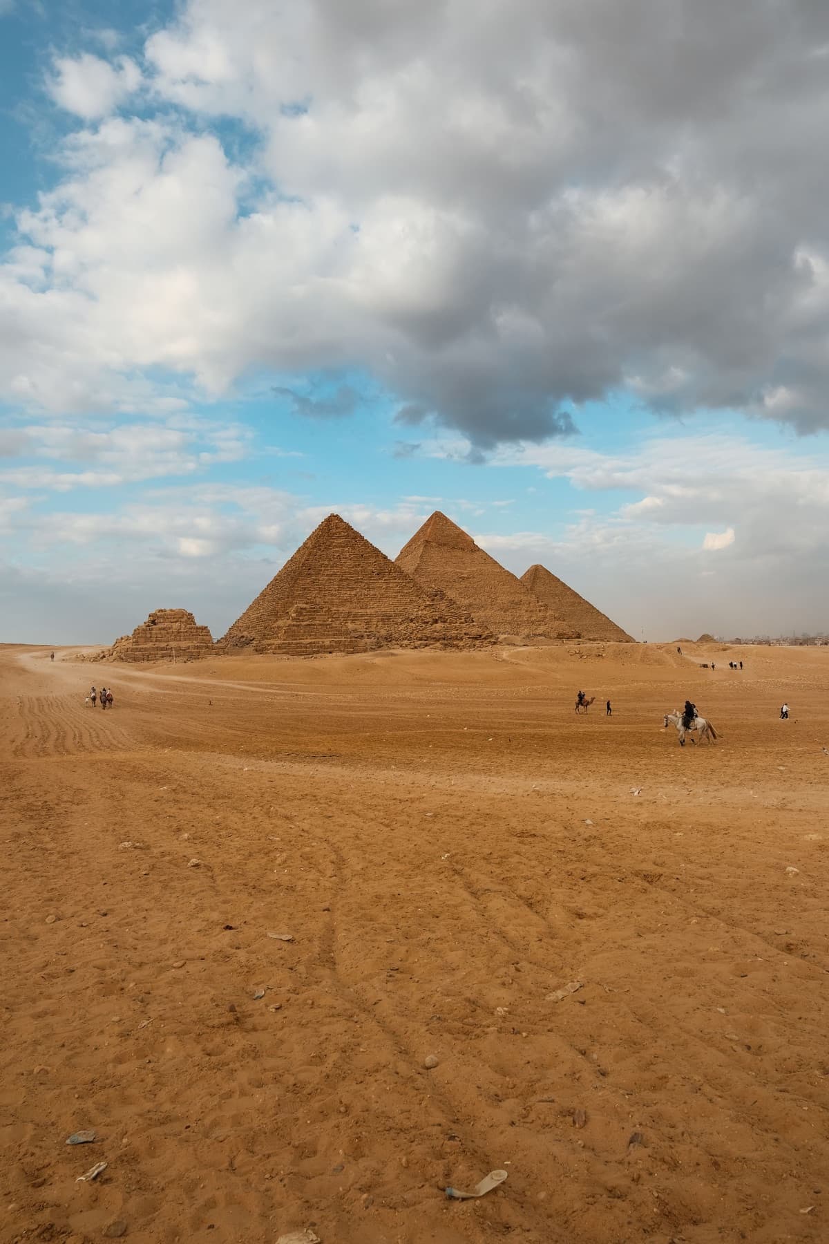 The Pyramids of Giza seen across the desert plateau — Cairo destination context.